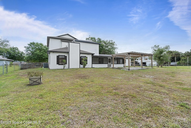 4000 Ocala St, Cocoa, FL 32926 - back of property featuring fence, a pergola, central air condition unit, a lawn, and a sunroom
