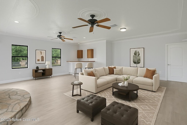 4000 Ocala St, Cocoa, FL 32926 - living area featuring light wood-style floors, ceiling fan, and ornamental molding