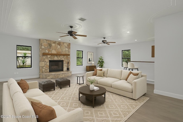 4000 Ocala St, Cocoa, FL 32926 - living area featuring ceiling fan, baseboards, light wood finished floors, and plenty of natural light