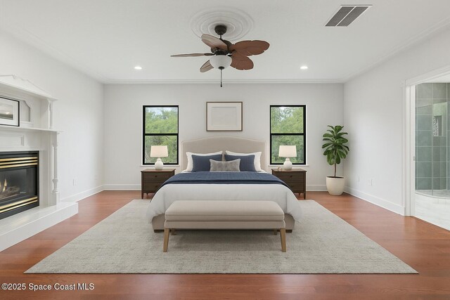4000 Ocala St, Cocoa, FL 32926 - bedroom featuring a glass covered fireplace, baseboards, visible vents, and multiple windows
