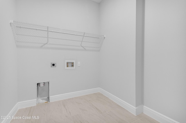 laundry area with laundry area, electric dryer hookup, baseboards, and hookup for a washing machine