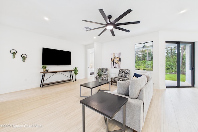 living area with ceiling fan, light wood-style floors, visible vents, and recessed lighting