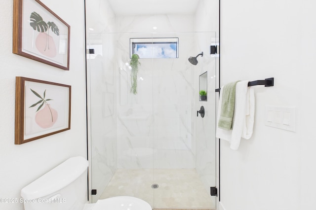 full bath with toilet and a marble finish shower