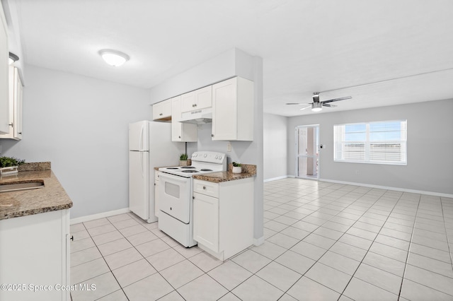 kitchen with white appliances, open floor plan, white cabinetry, light tile patterned floors, and under cabinet range hood