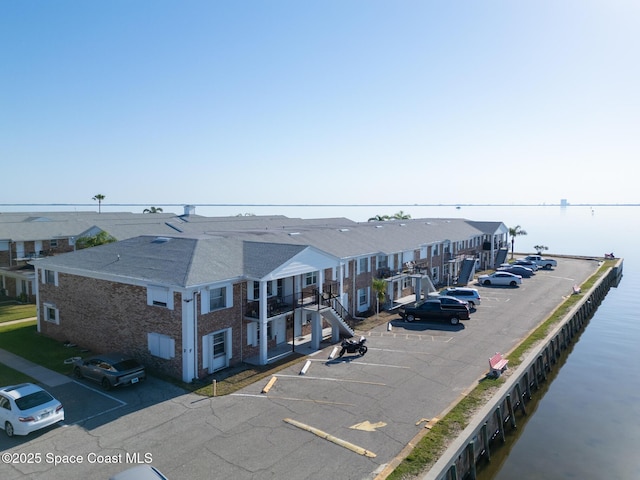 aerial view with a water view and a residential view