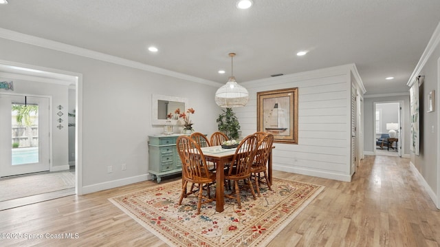 235 Northgrove Dr, Merritt Island, FL 32953 - dining area featuring ornamental molding, light wood-style floors, baseboards, and recessed lighting