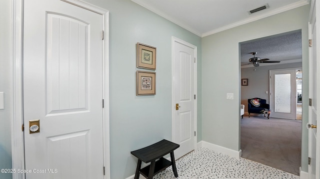 235 Northgrove Dr, Merritt Island, FL 32953 - foyer entrance featuring baseboards, ceiling fan, crown molding, and light colored carpet