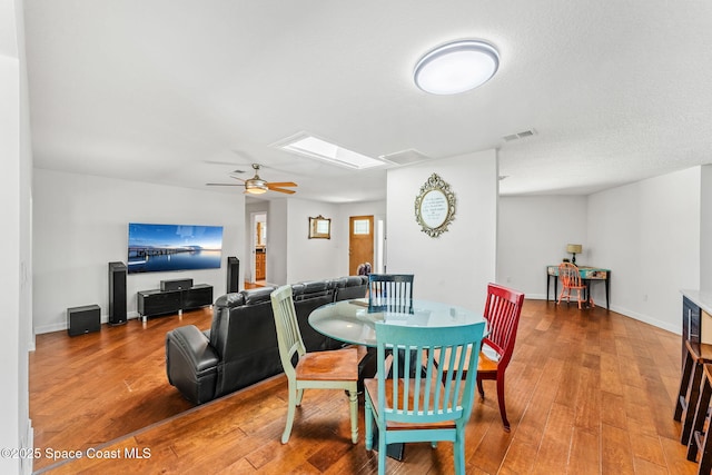 170 Maple Dr, Satellite Beach, FL 32937 - dining room with hardwood / wood-style flooring, visible vents, and a ceiling fan