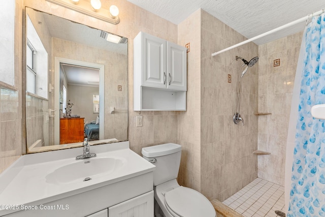 170 Maple Dr, Satellite Beach, FL 32937 - ensuite bathroom with ensuite bath, vanity, tiled shower, and toilet