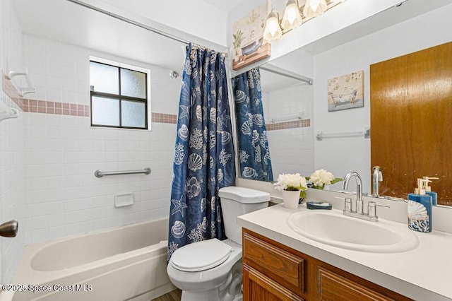 618 Americana Blvd NE, Palm Bay, FL 32907 - bathroom featuring shower / tub combo with curtain, vanity, and toilet