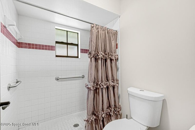 618 Americana Blvd NE, Palm Bay, FL 32907 - bathroom featuring a tile shower and toilet