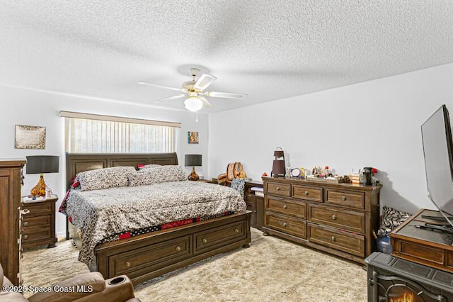 618 Americana Blvd NE, Palm Bay, FL 32907 - bedroom with light carpet, a textured ceiling, and ceiling fan