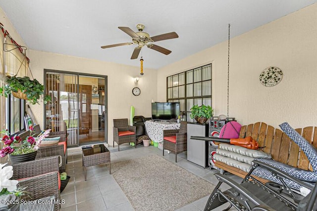 618 Americana Blvd NE, Palm Bay, FL 32907 - living room with a ceiling fan and tile patterned flooring
