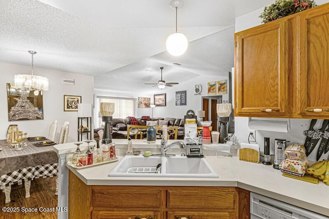 618 Americana Blvd NE, Palm Bay, FL 32907 - kitchen with a peninsula, white dishwasher, light countertops, and a sink