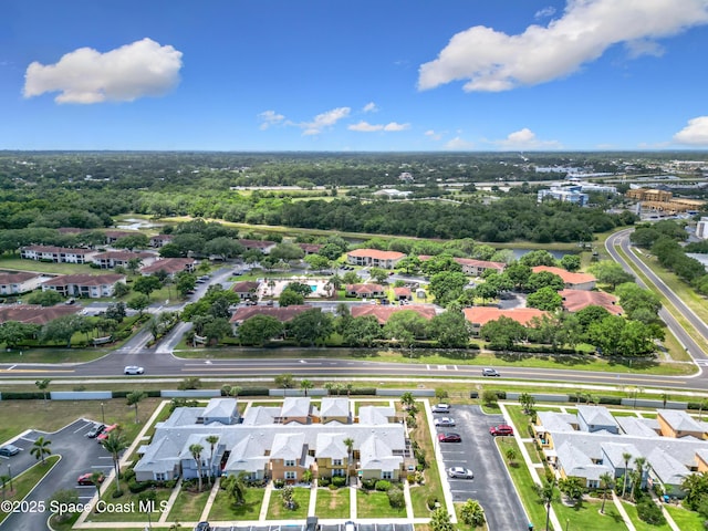 birds eye view of property with a residential view
