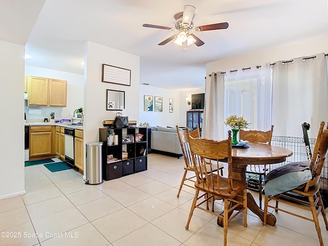 dining space with light tile patterned flooring and ceiling fan
