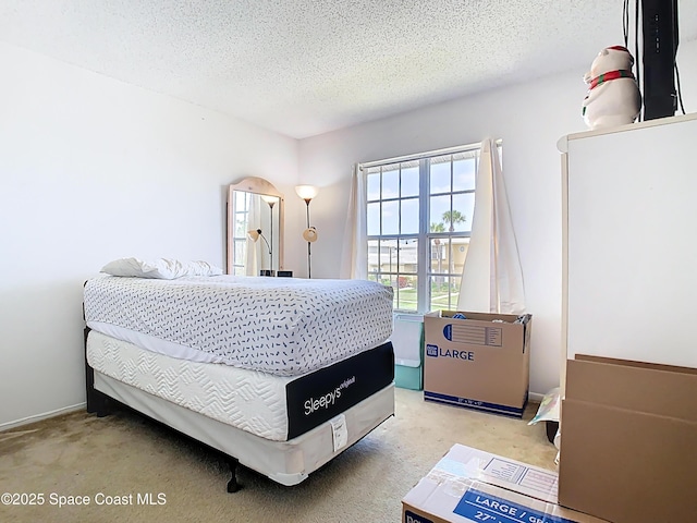 carpeted bedroom featuring a textured ceiling