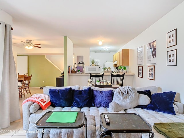 living room featuring ceiling fan