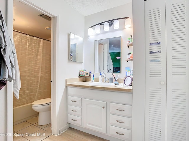 full bathroom with vanity, visible vents, toilet, curtained shower, and tile patterned floors