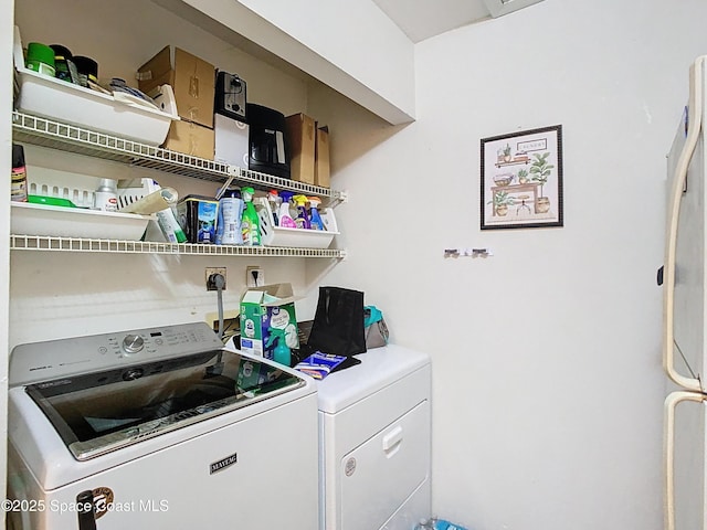 washroom featuring independent washer and dryer and laundry area