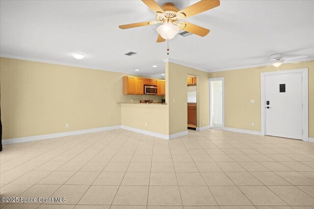 1845 Robalo Dr Unit 201D, Vero Beach, FL 32960 - unfurnished living room featuring baseboards, a ceiling fan, visible vents, and crown molding