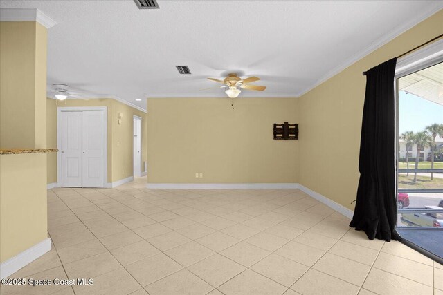 1845 Robalo Dr Unit 201D, Vero Beach, FL 32960 - empty room with light tile patterned floors, visible vents, ceiling fan, and crown molding