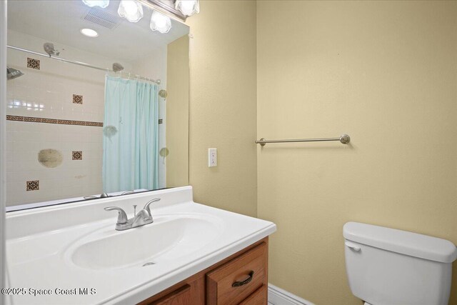 1845 Robalo Dr Unit 201D, Vero Beach, FL 32960 - bathroom with curtained shower, visible vents, toilet, and vanity