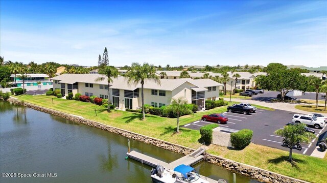 1845 Robalo Dr Unit 201D, Vero Beach, FL 32960 - drone / aerial view with a water view and a residential view