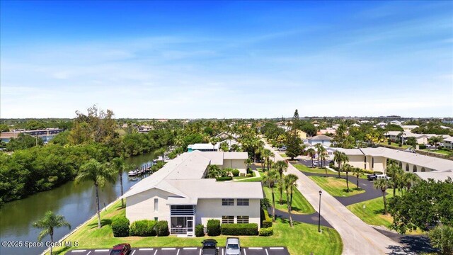 1845 Robalo Dr Unit 201D, Vero Beach, FL 32960 - drone / aerial view with a water view and a residential view