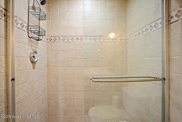 1845 Robalo Dr Unit 201D, Vero Beach, FL 32960 - full bathroom featuring a shower stall