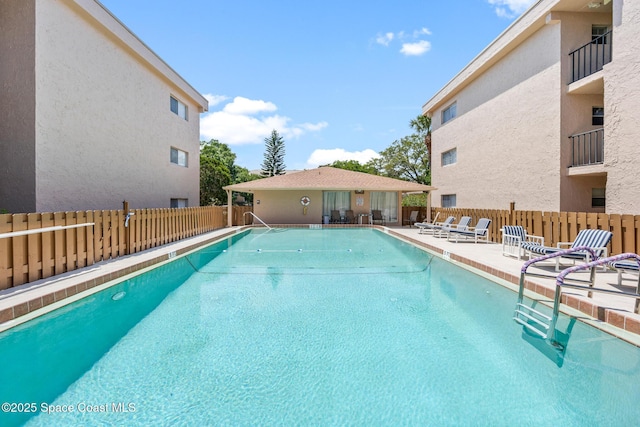 3150 N Harbor City Blvd Unit 341, Melbourne, FL 32935 - community pool featuring a patio and fence
