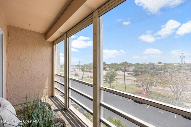3150 N Harbor City Blvd Unit 341, Melbourne, FL 32935 - unfurnished sunroom featuring a textured wall