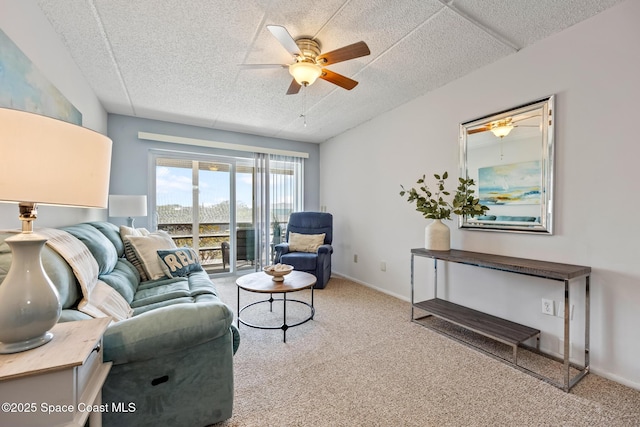 3150 N Harbor City Blvd Unit 341, Melbourne, FL 32935 - living room featuring carpet floors, baseboards, a ceiling fan, and a textured ceiling