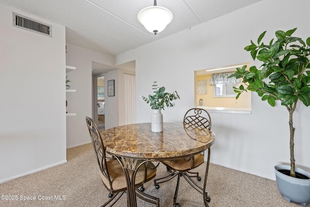 3150 N Harbor City Blvd Unit 341, Melbourne, FL 32935 - dining area featuring light colored carpet and visible vents