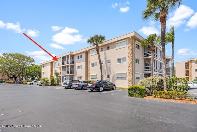 3150 N Harbor City Blvd Unit 341, Melbourne, FL 32935 - view of property featuring uncovered parking