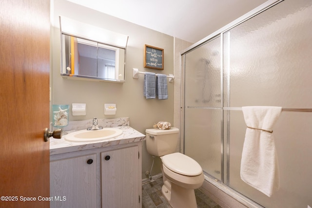 3150 N Harbor City Blvd Unit 341, Melbourne, FL 32935 - bathroom featuring vanity, tile patterned floors, a shower stall, and toilet