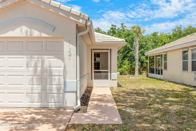 1157 Goldenrod Cir NE, Palm Bay, FL 32905 - property entrance featuring stucco siding and an attached garage
