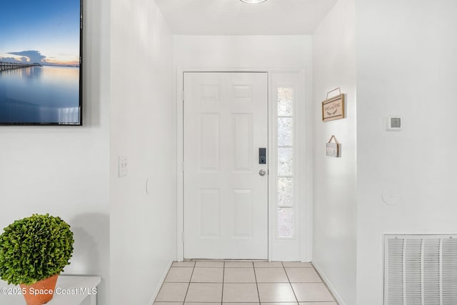 1157 Goldenrod Cir NE, Palm Bay, FL 32905 - entryway featuring light tile patterned floors, visible vents, and baseboards