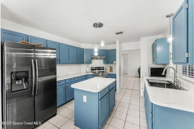 1157 Goldenrod Cir NE, Palm Bay, FL 32905 - kitchen with visible vents, blue cabinetry, appliances with stainless steel finishes, and a sink