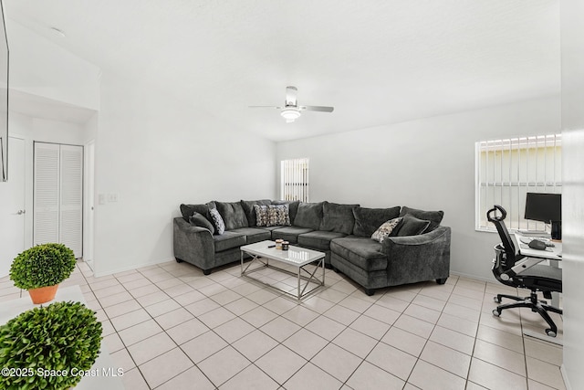 1157 Goldenrod Cir NE, Palm Bay, FL 32905 - living room featuring light tile patterned flooring, a ceiling fan, and baseboards