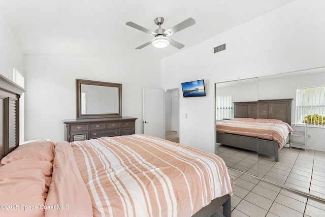 1157 Goldenrod Cir NE, Palm Bay, FL 32905 - bedroom featuring light tile patterned flooring, visible vents, a ceiling fan, and high vaulted ceiling