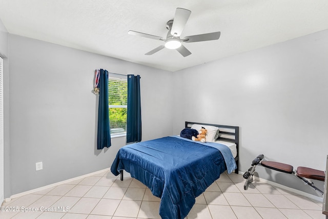 1157 Goldenrod Cir NE, Palm Bay, FL 32905 - bedroom with baseboards, a ceiling fan, and light tile patterned flooring