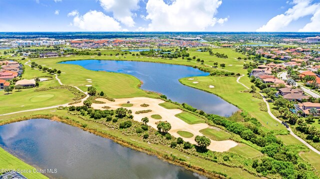 bird's eye view with view of golf course, a water view, and a residential view