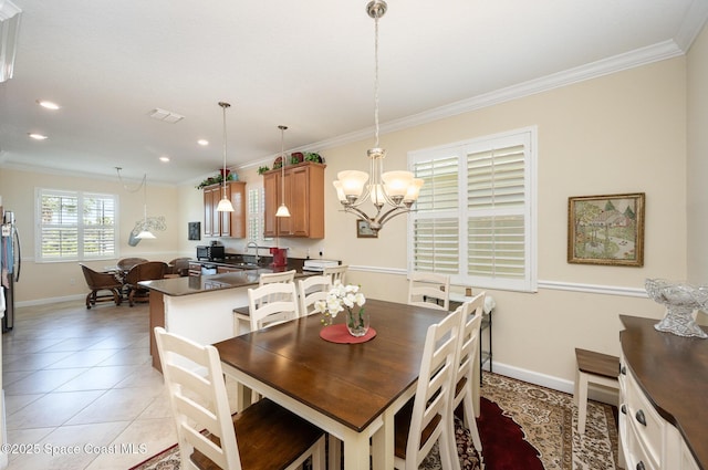 dining room with baseboards, recessed lighting, a chandelier, crown molding, and light tile patterned floors