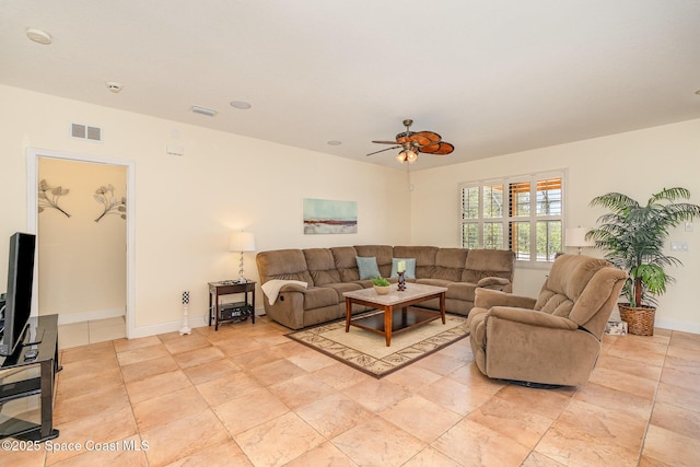 1472 Bent Palm Dr, Merritt Island, FL 32952 - living room with a ceiling fan and baseboards