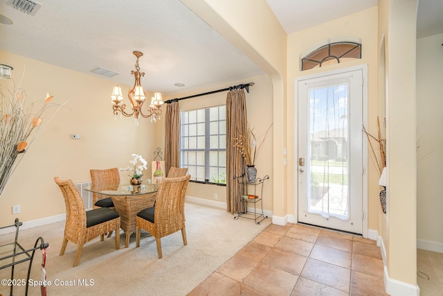 1472 Bent Palm Dr, Merritt Island, FL 32952 - dining area featuring a chandelier, baseboards, and light carpet