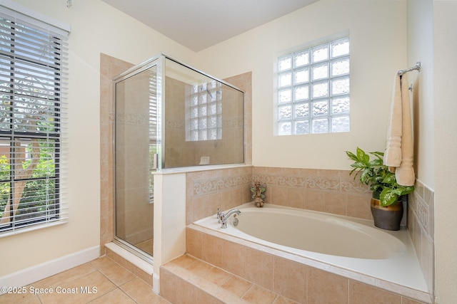 1472 Bent Palm Dr, Merritt Island, FL 32952 - bathroom with a garden tub, healthy amount of natural light, a shower stall, and tile patterned flooring