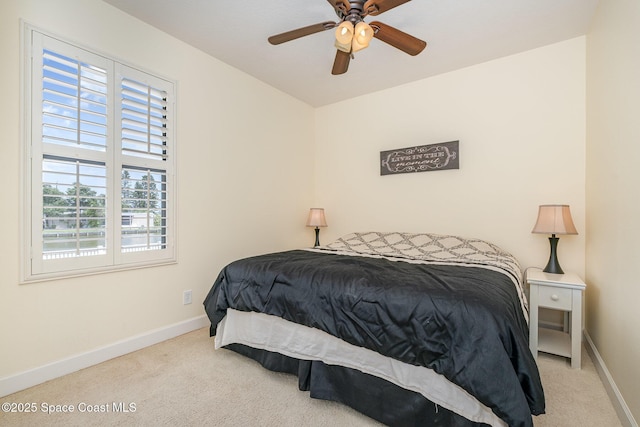 1472 Bent Palm Dr, Merritt Island, FL 32952 - bedroom with carpet floors, baseboards, and ceiling fan