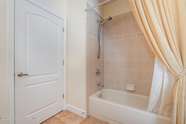 1472 Bent Palm Dr, Merritt Island, FL 32952 - bathroom featuring shower / bathtub combination with curtain and baseboards