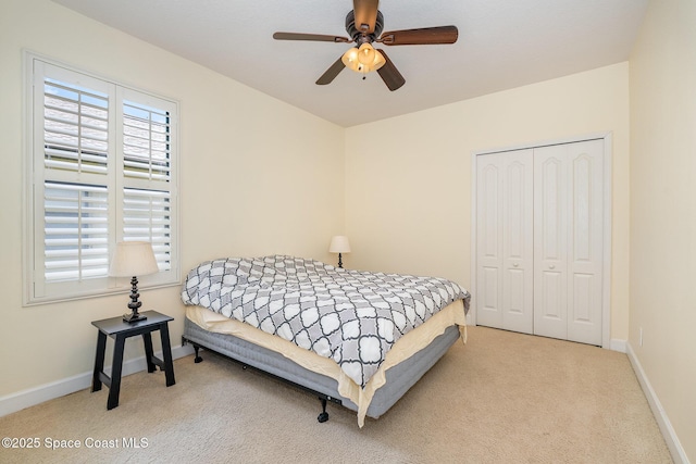 1472 Bent Palm Dr, Merritt Island, FL 32952 - bedroom with carpet, a closet, baseboards, and ceiling fan
